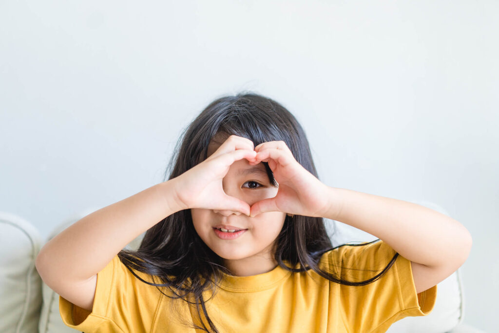 young girl focusing her left eye