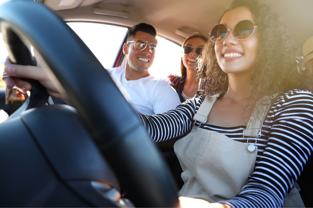friends driving wearing sunglasses