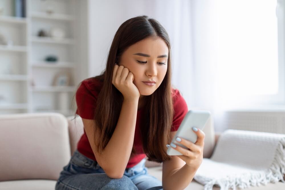 young woman looking at screen
